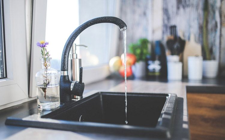 Properly functioning faucet showcasing the result of replacing a kitchen faucet